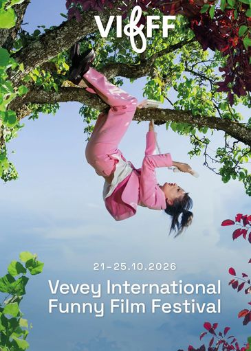 Person in pink suit hanging from a tree branch.