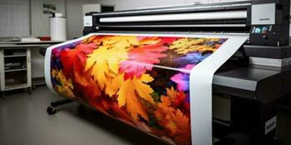 Large format print of autumn leaves being printed on a large format printer.