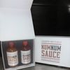 Country Boy's NumNum Sauce set with mild and hot flavors in white packaging.