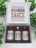 A gift box of three bottles of Num Num Sauce with a Southern style theme.