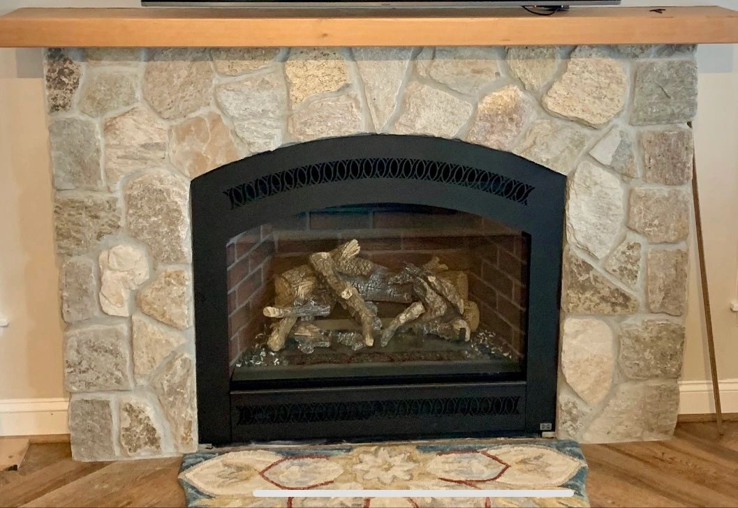 Stone veneer fireplace surround