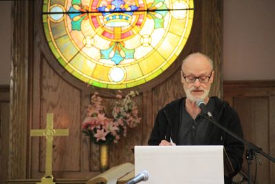 A church member reads a passage from the Bible during Sunday service.