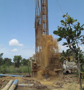 Water drilling boreholes to provide clean water for impoverished villagers.
