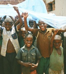 distributing mosquito nets at a boarding school in Uganda.  