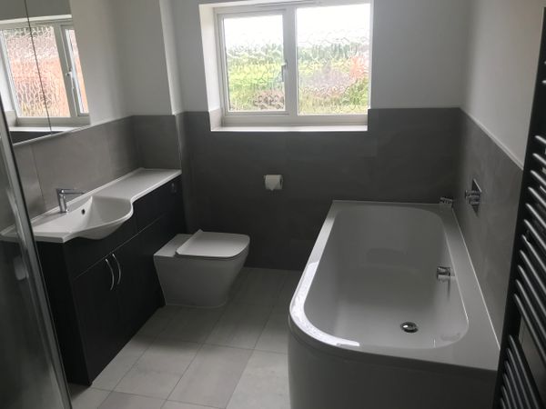 Bathroom installation with all in one basin, worktop for easy cleaning, tiling & Karndeen flooring
