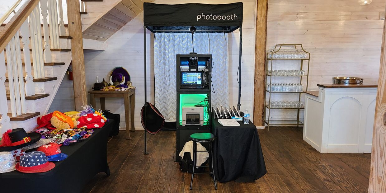 photobooth with table full of props next to stairs