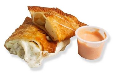 Cheese empanada cut in half to show the inside with mayo-ketchup sauce on the side