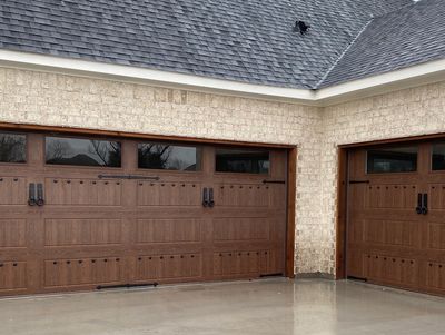 Wooden garage doors with automatic openers.