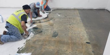 Spreading fill material on concrete