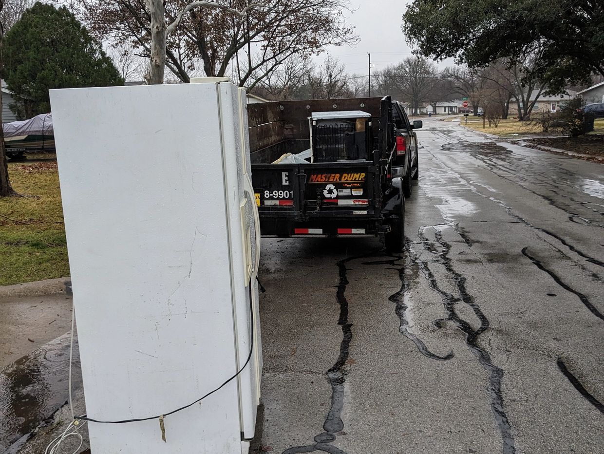 Refrigerator Removal in fort worth Texas on a rainy day