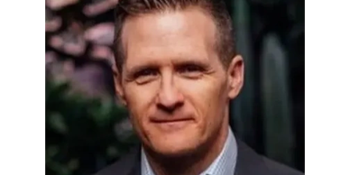 Portrait of a man in a suit.