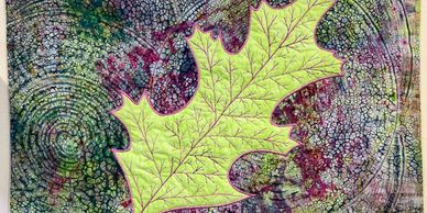 Quilted wallhanging featuring a leaf by SueEllen Romanowski
