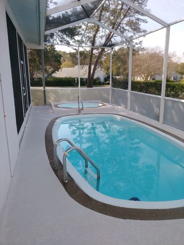 A pool deck with a fiberglass design