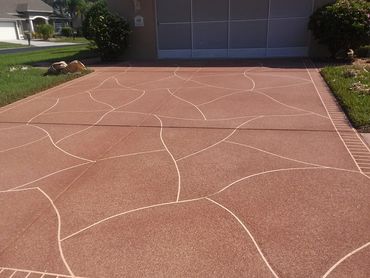 A view of a large driveway with a brick design