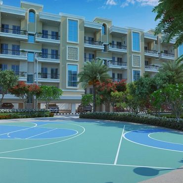 Modern apartment complex with outdoor basketball court and lush greenery.