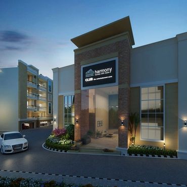 Modern residential club entrance with stylish architecture and evening lighting.