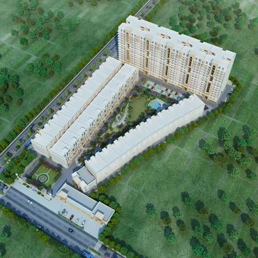 Aerial view of a modern residential complex surrounded by greenery.