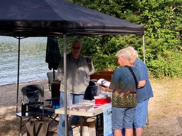 three women at USVHS booth
