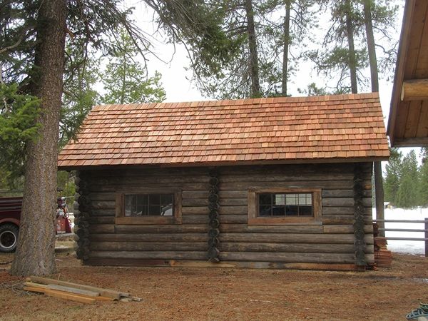 various phases of building/restoring Maki Cabin
