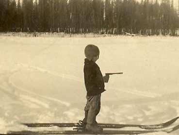 vintage photo of young boy on skis