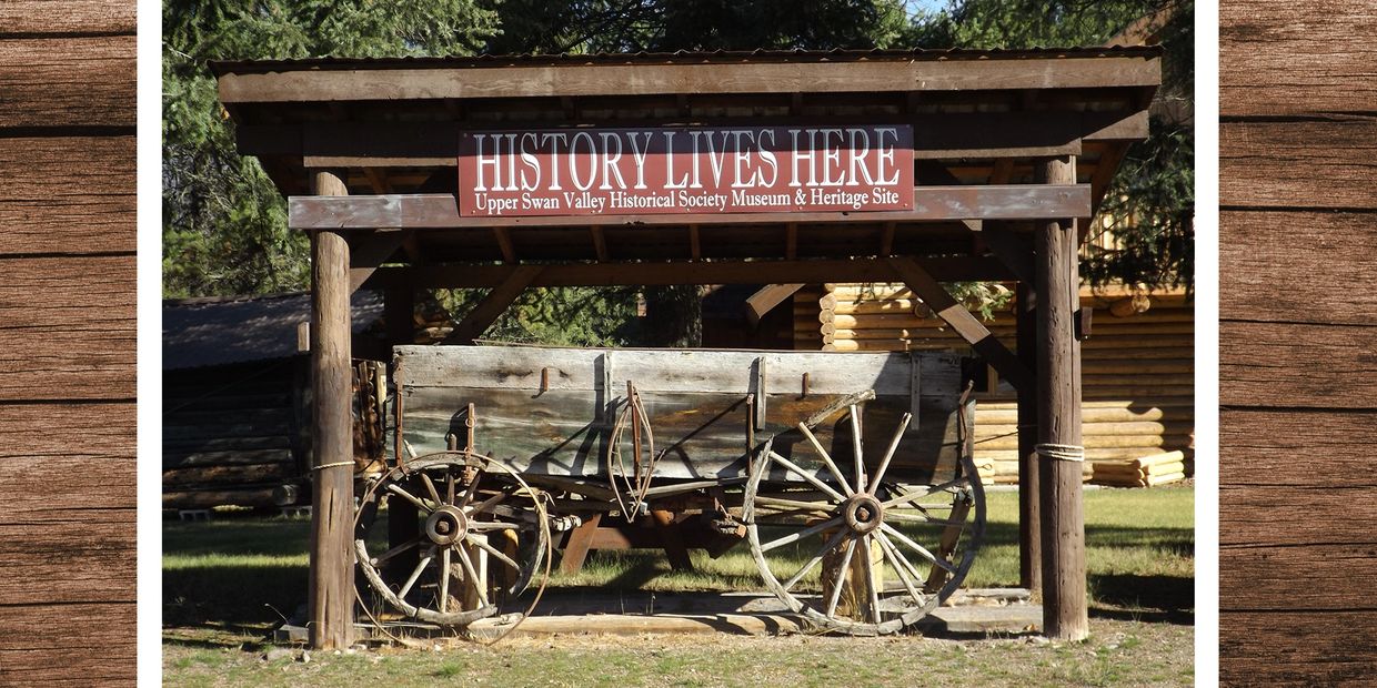 History lives here sign and historic wagon