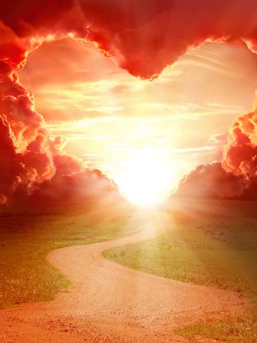 A curvy dirt road  takes you to a heart opening in red clouds the sun shining through the heart.
