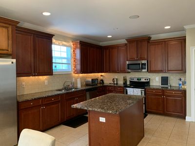 Fully stocked large gourmet kitchen.