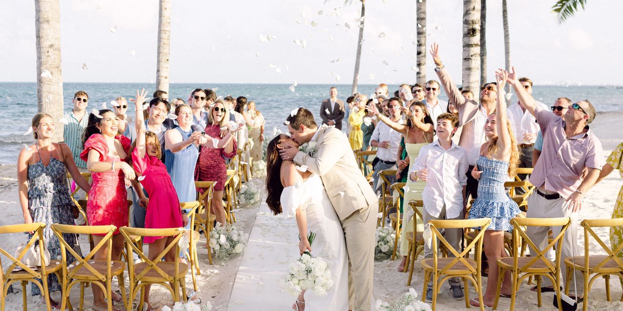 Bride and Groom Kissing at end of Aisle Garza Blanca Cancun