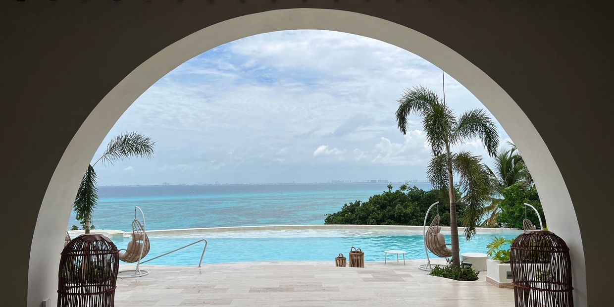 Pool view and ocean view of Isla Mujeres at all inclusive resort. 