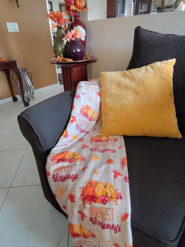 Festive Fall Throw and pillow added to the corner of the couch.