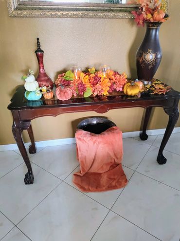 Add some color by adding a throw blanket to create some  Fall impact.