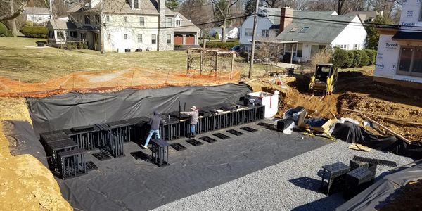 Brentwood StormTanks installer. water catch basin, geotextile fabric 2b stone. Skid steer