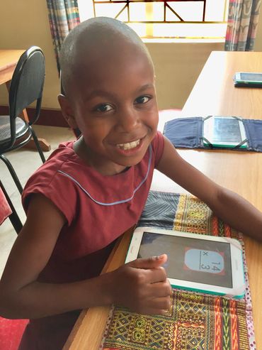 A girl with a Tablet that's part of an EduPak.