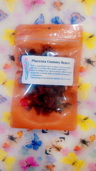 A package of placenta gummy bears with usage instructions on a butterfly-patterned background.
