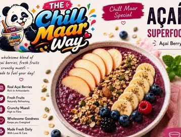 Açaí bowl topped with fruits and muesli.