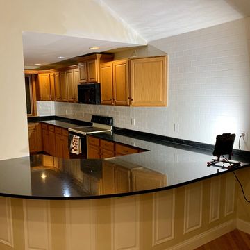 Kitchen Cabinets, Granite Countertop Installation, Subway Tiles. 