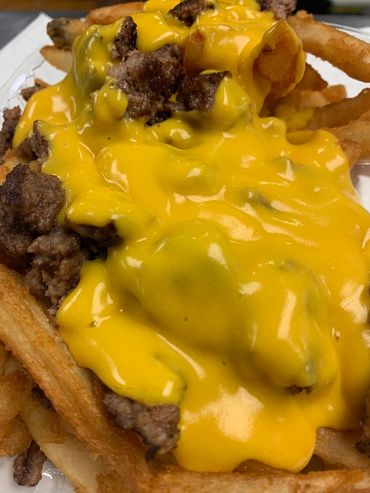 Alt="Beef cheesy fries at MooSa's"
