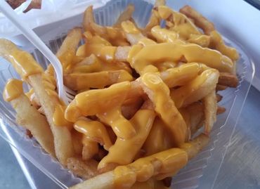 <img src=" cheese fries.png" alt="Basket of french fries with cheese sauce">