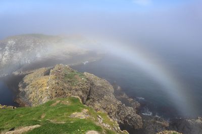 rainbow over Carrick-a-Rede Ireland
