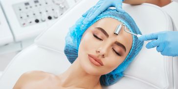 Galvanic facial to treat dry skin.