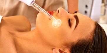 High frequency facial to treat acne.