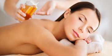 Aromatherapy massage using essential oils to relax the mind and body.