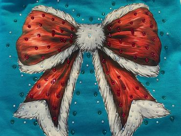100% Long sleeve Gildan turquoise tee. Fluffy santa bow covered with rhinestones. $20