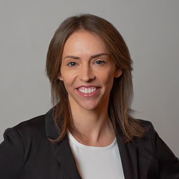 Professional woman smiling in a headshot.