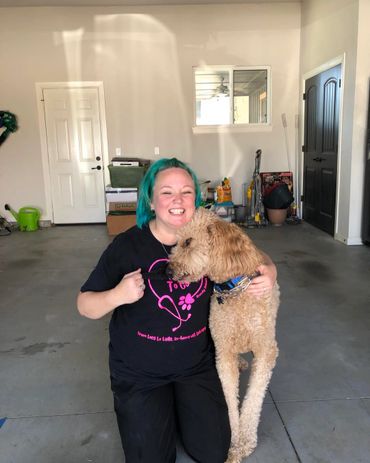 Brandy with Dobby the goldendoodle after his nail trim