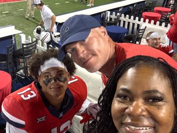 Devin Hyatt with mom and dad. Arizona game.