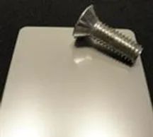 White metal plate and screw blurry image