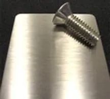Screw on top of a metal plate