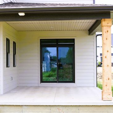 New James Hardie siding and vinyl porch soffit.