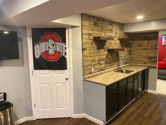 Finished basement with wet bar.